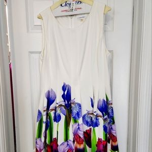 CK sleeve  scuba dress w/  floral print along FRONT LEFT hem wraps to back hem